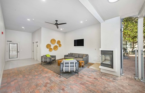 a living room with a couch and a fireplace